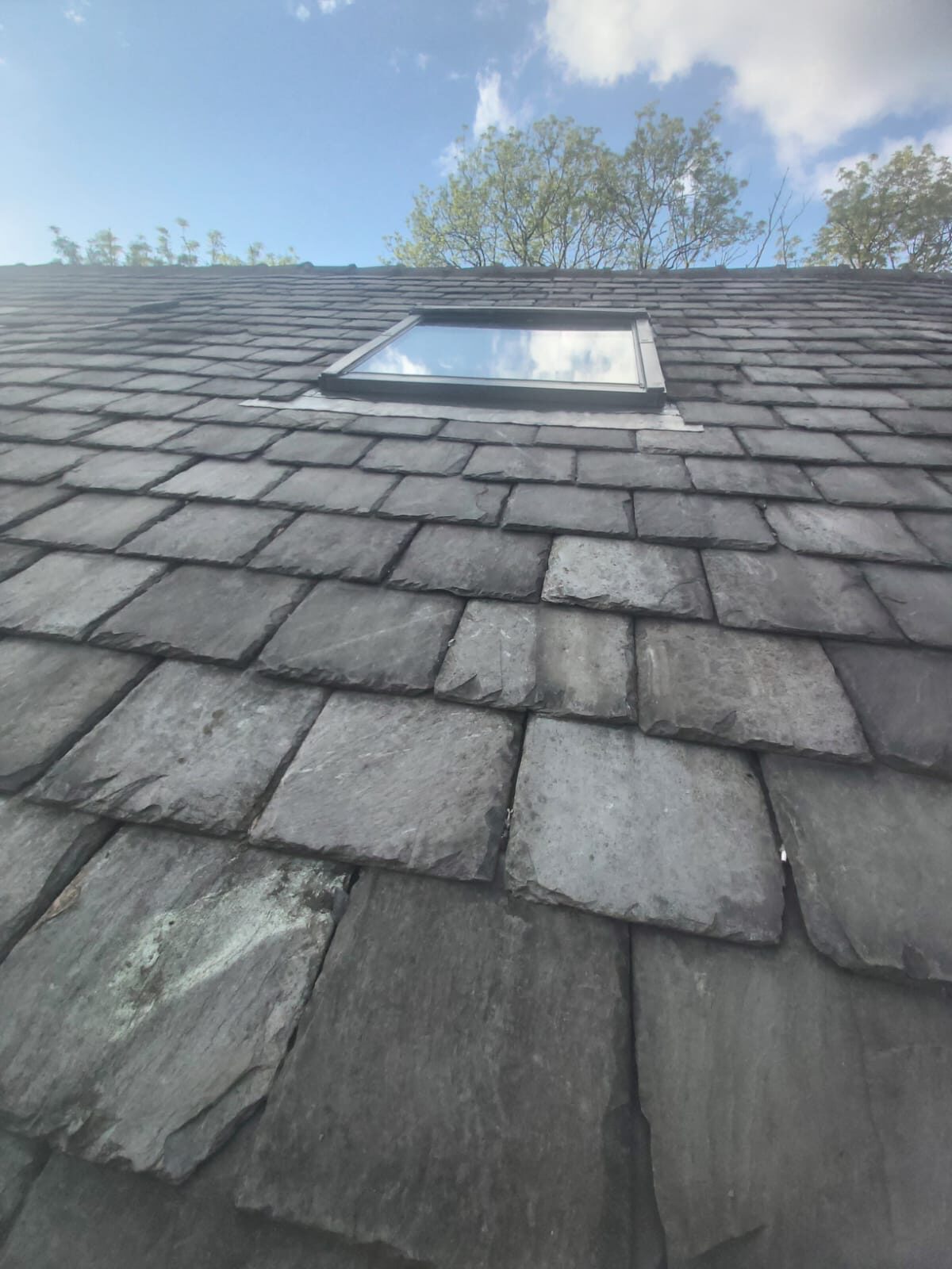 Velux skylight installed in slate roof